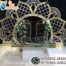 wedding reception stage backdrop, peacock theme wedding decor, golden wedding backdrop, floral wedding arch stage, luxury reception setup, engagement stage decoration, modern Indian wedding stage, bridal shower backdrop, couple seating decor, artificial flower arch, metal wedding backdrop, wedding photo booth frame, premium wedding decoration