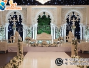 White 3D wedding stage backdrop ,English style wedding stage panels ,Luxury reception stage decor ,White arch wedding backdrop frames ,Indian wedding stage setup Australia ,Wedding stage decorations with Ganesha statues ,Indoor wedding stage ideas ,Elegant wedding backdrop panels Customizable wedding stage decor ,Modern white wedding stage design