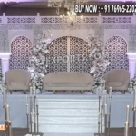 wedding reception stage backdrop, peacock theme wedding decor, golden wedding backdrop, floral wedding arch stage, luxury reception setup, engagement stage decoration, modern Indian wedding stage, bridal shower backdrop, couple seating decor, artificial flower arch, metal wedding backdrop, wedding photo booth frame, premium wedding decoration
