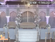 wedding reception stage backdrop, peacock theme wedding decor, golden wedding backdrop, floral wedding arch stage, luxury reception setup, engagement stage decoration, modern Indian wedding stage, bridal shower backdrop, couple seating decor, artificial flower arch, metal wedding backdrop, wedding photo booth frame, premium wedding decoration