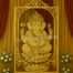 "Golden decorative backdrop frame of Lord Ganesha sitting on a lotus, designed for wedding stage decoration and festive events, by DST International."