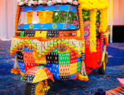 “Punjabi Style Bridal Entry Tuk Tuk decorated for UK wedding with colorful motifs and elegant bridal seating”