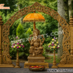 Royal Wooden Carved Ganesha Entrance Gate Decoration with intricate floral carvings, central Ganesha statue under a golden umbrella, flower stands on both sides, perfect for wedding or cultural event entrance decor.