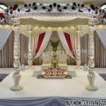 "Traditional Indian Wedding Fiber Carved Mandap Setup in ivory beige color with carved fiber pillars and canopy, designed for Hindu marriage ceremonies."