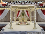 "Traditional Indian Wedding Fiber Carved Mandap Setup in ivory beige color with carved fiber pillars and canopy, designed for Hindu marriage ceremonies."