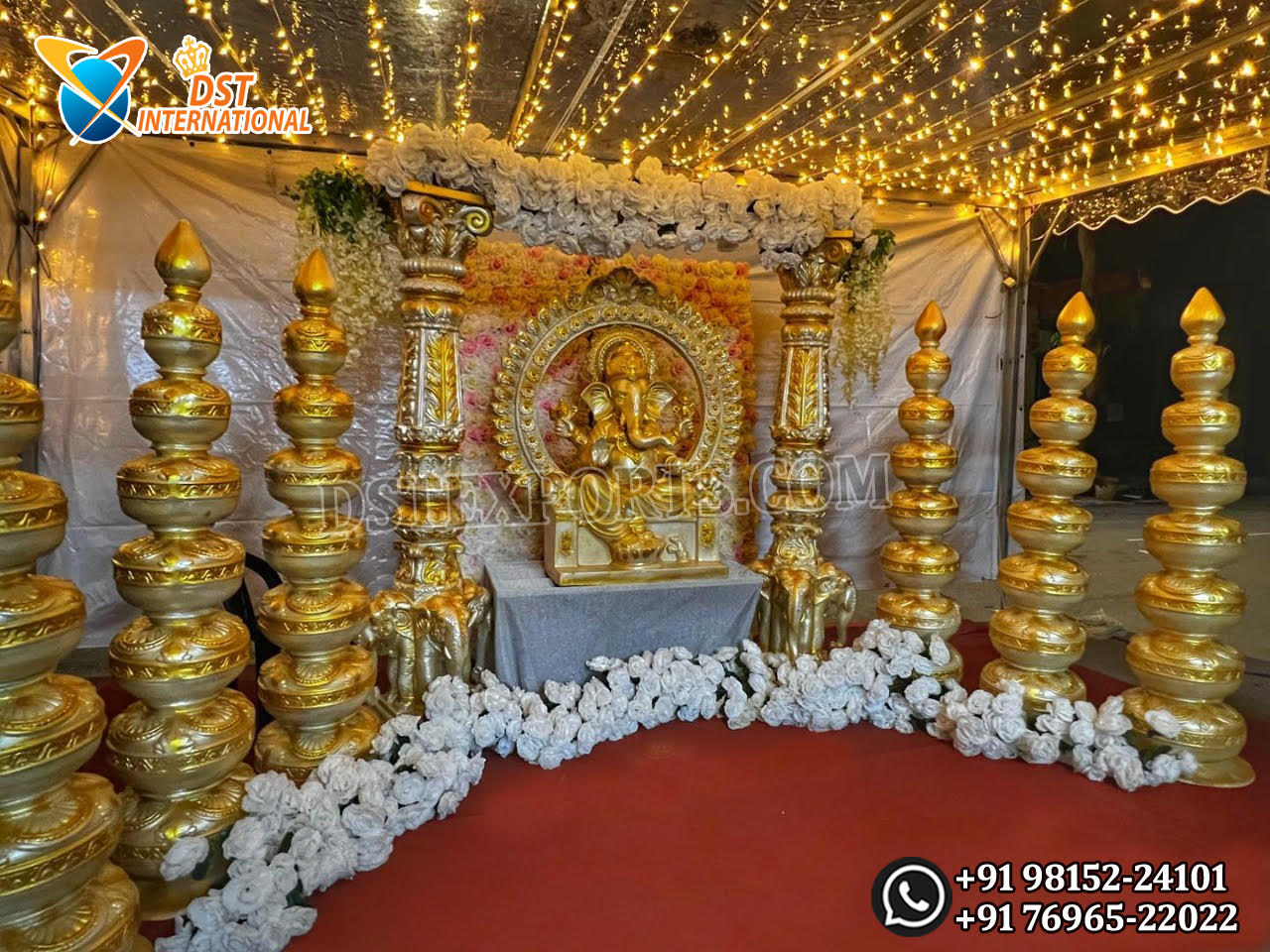 uy South Indian Wedding Ganesha Theme Entrance Decoration – a luxurious golden mandap-style setup featuring Ganesha idol, fiber pillars, and traditional lamps. Perfect for cultural weddings and temple events.