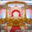 golden round wedding mandap, traditional Indian mandap, royal Hindu wedding stage, fiber carved mandap, luxury wedding décor, DST Exports mandap, golden pillar mandap, round shape mandap design, Indian wedding stage setup, traditional wedding mandap, handcrafted wedding stage, golden mandap for marriage, destination wedding décor, Hindu mandap manufacturer, elegant Indian mandap design