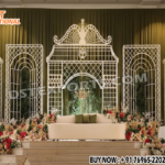 “Trendy geometric metal backdrop frames for grand wedding reception stage with floral decor and arch design by DST International”